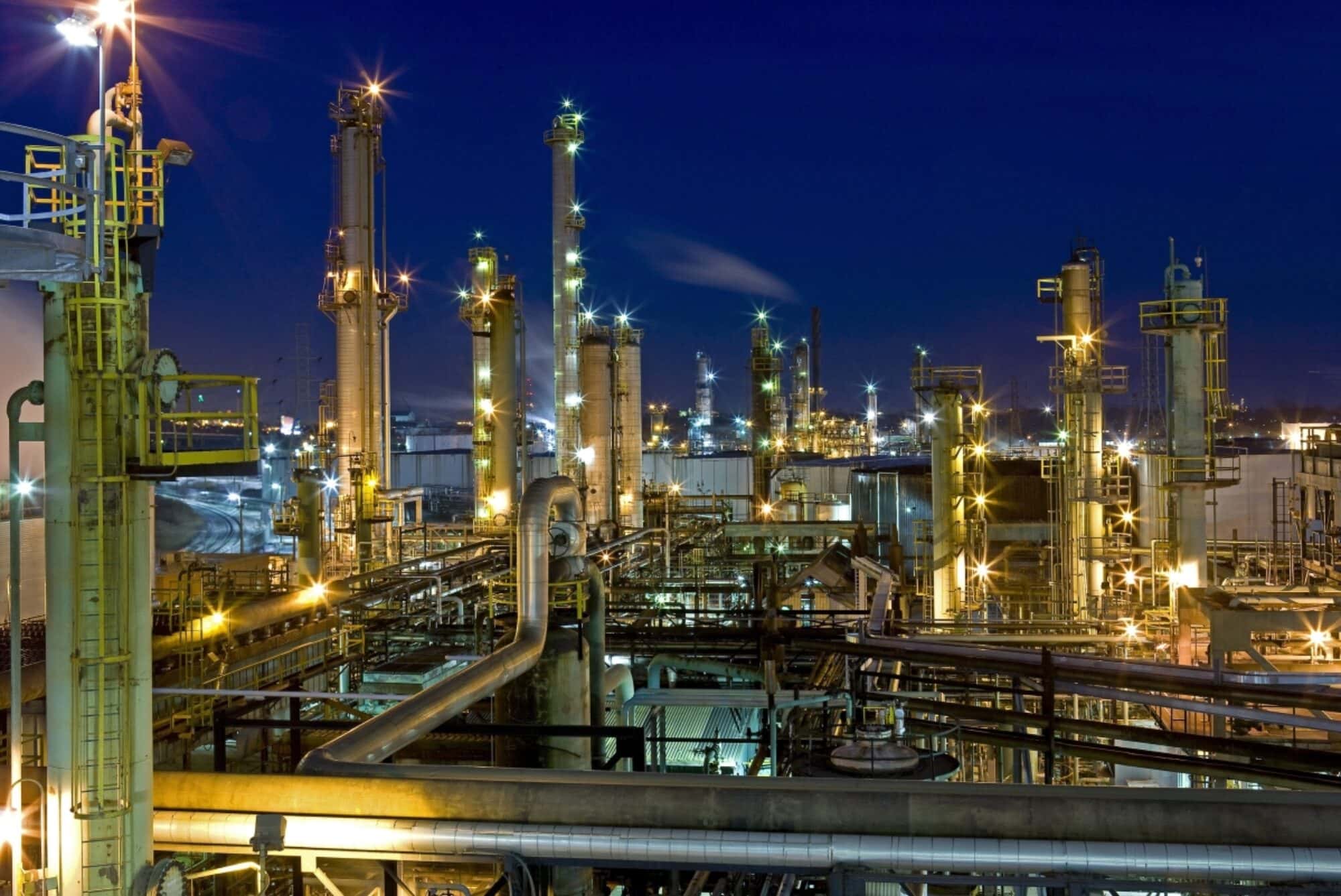 Oil refinery lit up at night